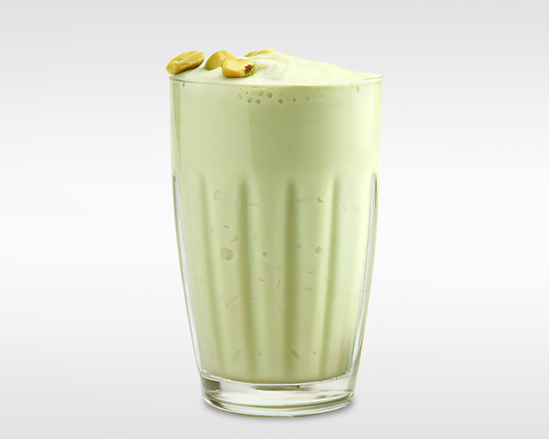 Image of Pistachio smoothie in a glass.